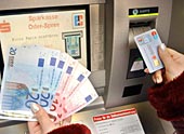 The new euro notes at a German cashpoint